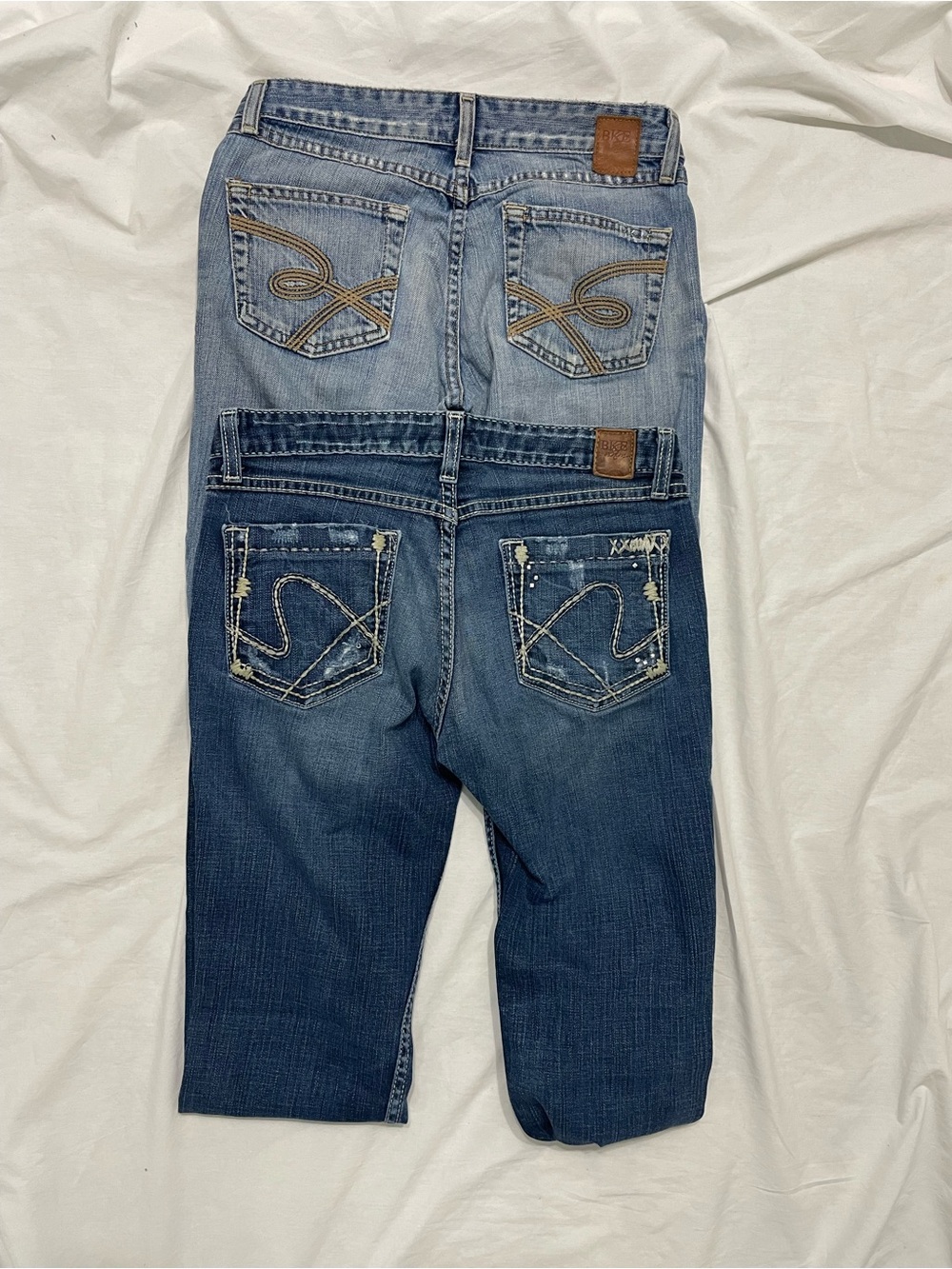 Two pairs of vintage Y2K-era BKE (Buckle) low-rise bootcut denim jeans